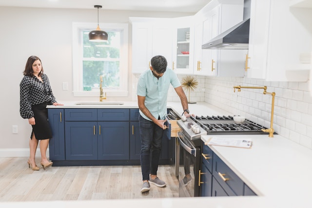 property-manager-and-landlord-inspecting-property-kitchen